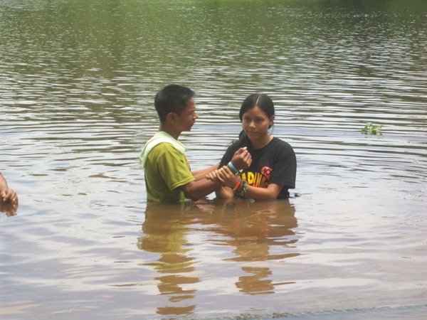 Bequert’s baptism in the river. (Chapter 4)