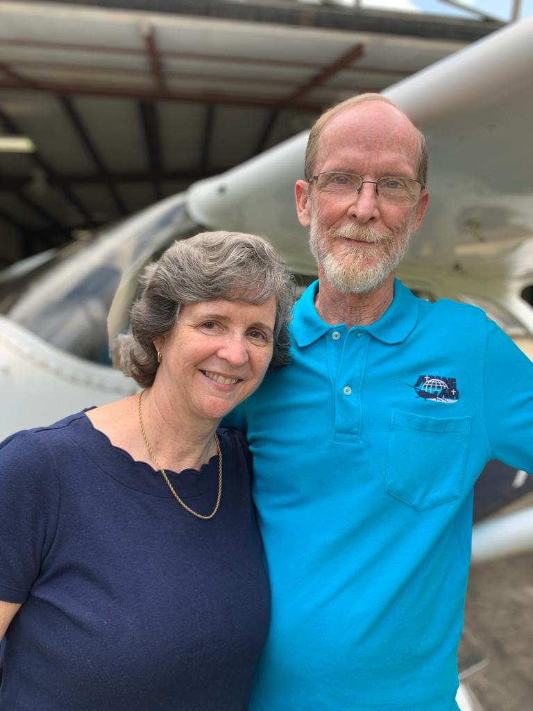 Allen and Kim Yoder in front of their float plane.